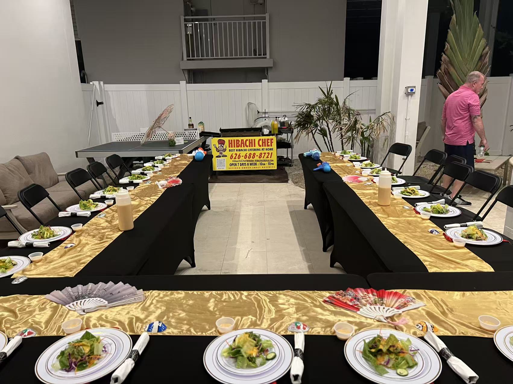Large indoor hibachi setup with gold table runners